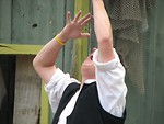 Free Stock Photo: Sword swallower with sword in mouth