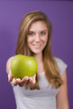Free Stock Photo: A young woman holding a green apple