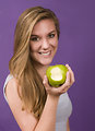 Free Stock Photo: A young woman showing a bitten green apple
