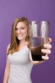 Free Stock Photo: A young woman holding a glass of water