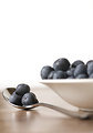 Free Stock Photo: A bowl of and spoonful of blueberries