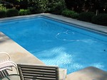 Free Stock Photo: Chairs and pool in the shade