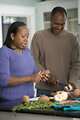 Free Stock Photo: An African-American couple preparing a healthy meal