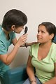Free Stock Photo: A female doctor examining a patient