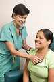 Free Stock Photo: A female doctor examining a patient