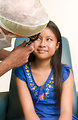 Free Stock Photo: A youn girl being examined by her doctor