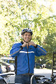 Free Stock Photo: A bicyclist putting on a safety helmet