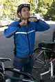 Free Stock Photo: A bicyclist putting on a safety helmet
