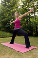 Free Stock Photo: A young woman stretching before exercise