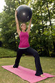 Free Stock Photo: A young woman stretching before exercise