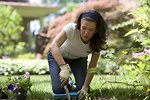 Free Stock Photo: A woman enjoying gardening outdoors