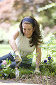 Free Stock Photo: A woman enjoying gardening outdoors