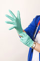 Free Stock Photo: A healthcare provider donning a pair of latex gloves