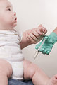 Free Stock Photo: A baby receiving a vaccine injection.