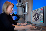 Free Stock Photo: A woman using an electron microscope