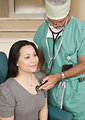 Free Stock Photo: A doctor examining a female patient