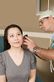 Free Stock Photo: A doctor examining a female patient