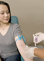 Free Stock Photo: A doctor extracting blood from a patient