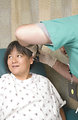 Free Stock Photo: A female patient being examined by her doctor