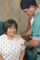 Free Stock Photo: A female patient being examined by her doctor