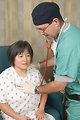 Free Stock Photo: A female patient being examined by her doctor
