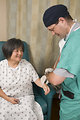 Free Stock Photo: A female patient being examined by her doctor