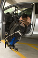 Free Stock Photo: A disabled man in a wheelchair getting out of a car