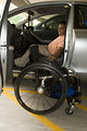 Free Stock Photo: A disabled man in a wheelchair getting out of a car