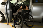 Free Stock Photo: A disabled man in a wheelchair getting out of a car