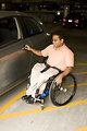 Free Stock Photo: A disabled man in a wheelchair getting out of a car