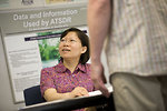 Free Stock Photo: Speaking at a town hall meeting on behalf of the Agency for Toxic Substances and Disease Registry (ATSDR), this Asian-American woman was in the process of educating attendees. The purpose of these meetings is to collect community concerns, and share health messages about local environmental issues. At this point in the meeting, she was about to address a meeting participant during a breakout question/answer session.