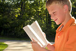 Free Stock Photo: A boy reading a book