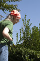 Free Stock Photo: A woman doing yardwork outside.