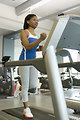 Free Stock Photo: A woman running on a treadmill