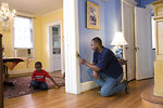 Free Stock Photo: A man repairing a door frame in his home