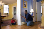 Free Stock Photo: A man repairing a door frame in his home