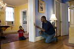 Free Stock Photo: A man repairing a door frame in his home