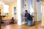Free Stock Photo: A man repairing a door frame in his home
