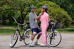 Free Stock Photo: An African-American couple preparing for bike ride