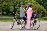 Free Stock Photo: An African-American couple preparing to ride bikes