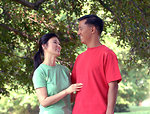 Free Stock Photo: An asian couple smiling at each other outdoors