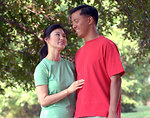 Free Stock Photo: An asian couple smiling at each other outdoors