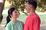 Free Stock Photo: An asian couple smiling at each other outdoors