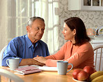 Free Stock Photo: A woman and older man sitting at a table