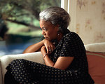 Free Stock Photo: An African-American woman looking out a window