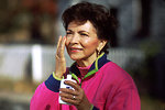 Free Stock Photo: A woman applying sunscreen to her face.