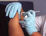 Free Stock Photo: A nurse administers a vaccine