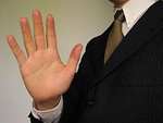 Free Stock Photo: Business man in suit holding hand up