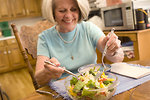Free Stock Photo: A woman eating a fresh salad