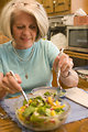 Free Stock Photo: A woman eating a fresh salad